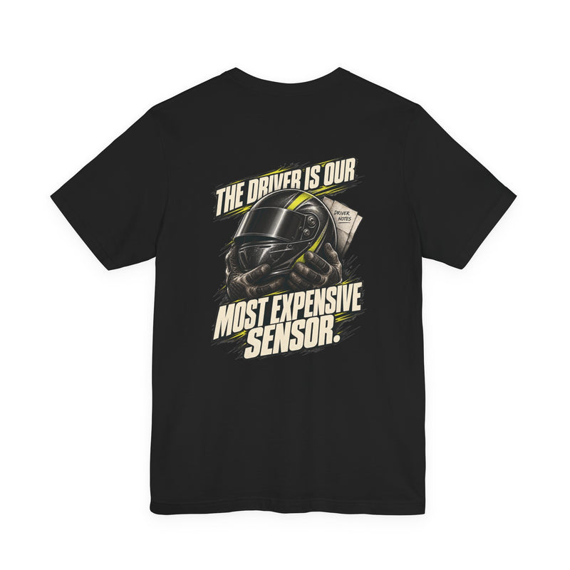 The Driver Is Our Most Expensive Sensor. — Pit Crew Tee — back graphic on black Bella+Canvas 3001