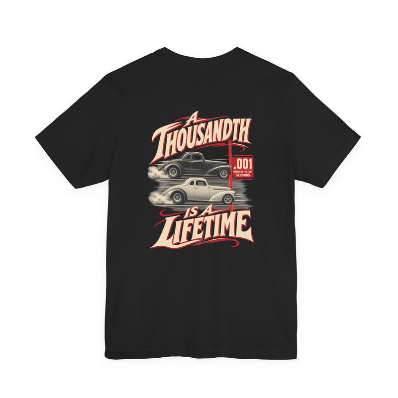 Back of black Bella+Canvas 3001 with two vintage drag coupes and A Thousandth Is a Lifetime photo-finish artwork