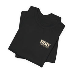 Dinner Is After the Oil-Down. — Trackside Tee — folded black tee